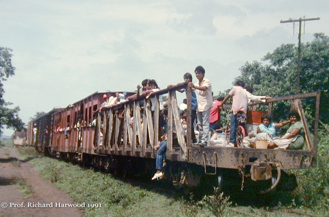 Passengers on Nicaragua railroad open flatcar 1991